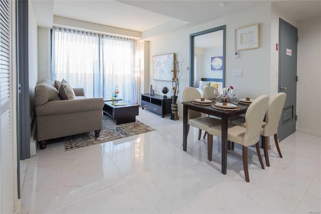 dining space with marble finish floor