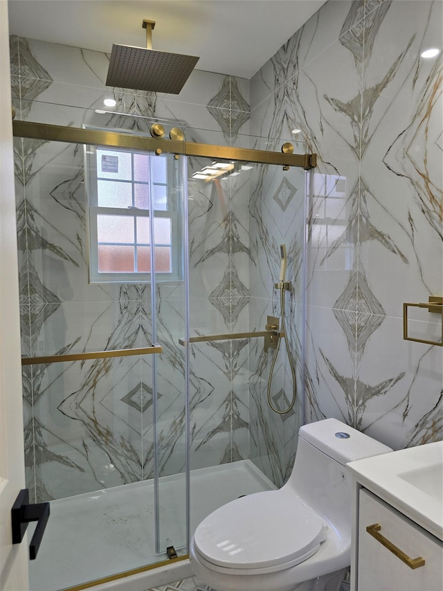 bathroom with a marble finish shower, toilet, tile walls, and vanity