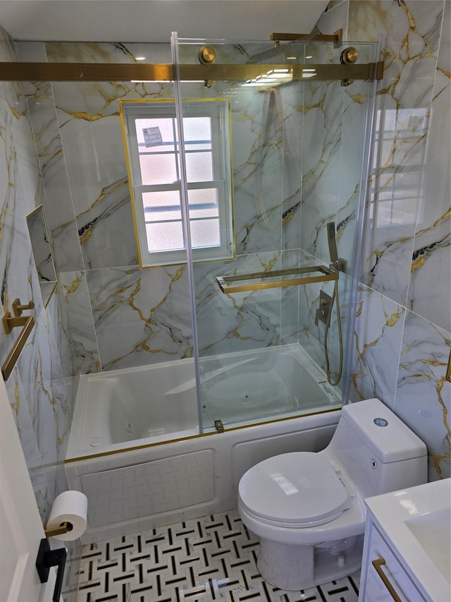 bathroom featuring shower / bath combination with glass door, tile walls, vanity, and toilet