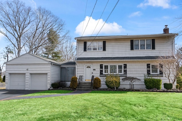 traditional-style home featuring driveway, a front lawn, a shingled roof, a garage, and a chimney