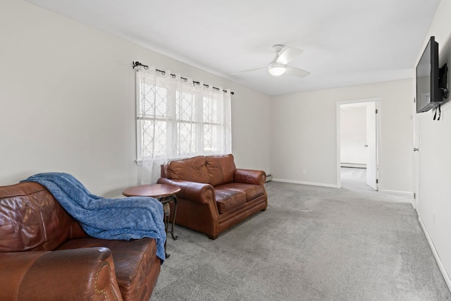 living area with a baseboard heating unit, carpet, baseboards, baseboard heating, and ceiling fan