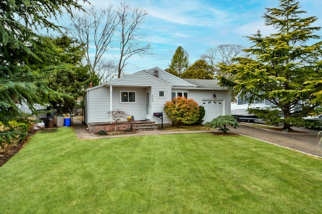 view of front facade with aphalt driveway, a garage, and a front lawn