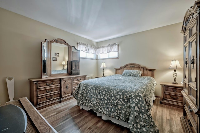 bedroom with wood finished floors