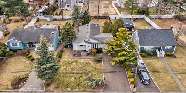 birds eye view of property with a residential view