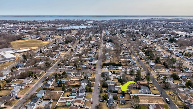 drone / aerial view featuring a residential view and a water view