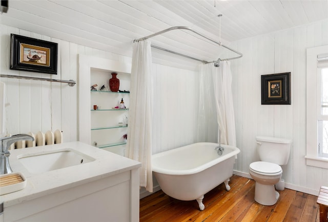 full bath with vanity, hardwood / wood-style flooring, and toilet