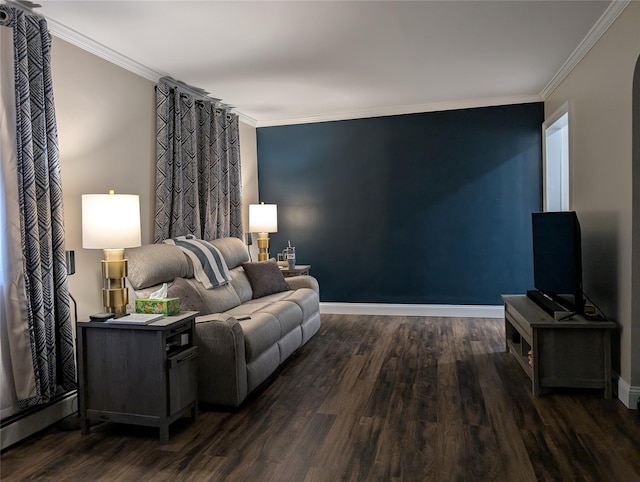 living area with dark wood finished floors, crown molding, and baseboards