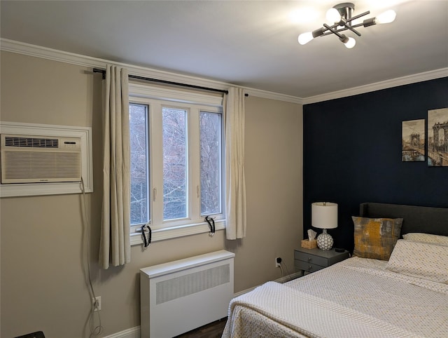 bedroom with radiator, crown molding, and a wall unit AC