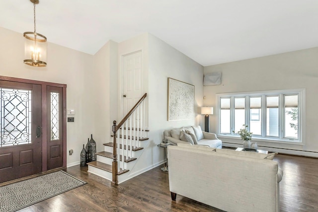 entryway featuring dark wood-type flooring, stairway, and baseboards