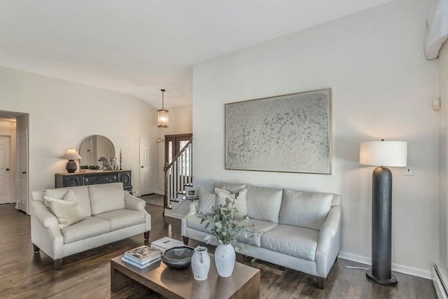 living area featuring a baseboard heating unit, lofted ceiling, stairway, and wood finished floors