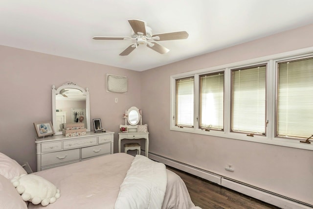 bedroom featuring wood finished floors, a ceiling fan, and a baseboard radiator