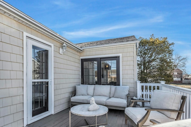 wooden terrace featuring outdoor lounge area