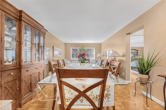 dining space featuring baseboards