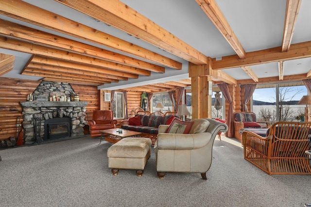 carpeted living area featuring beam ceiling and a stone fireplace