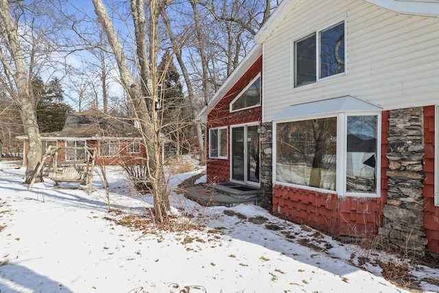 view of snow covered house