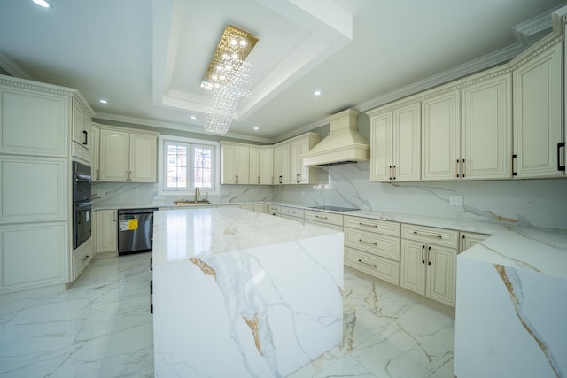 kitchen with backsplash, a kitchen island, premium range hood, black appliances, and a raised ceiling