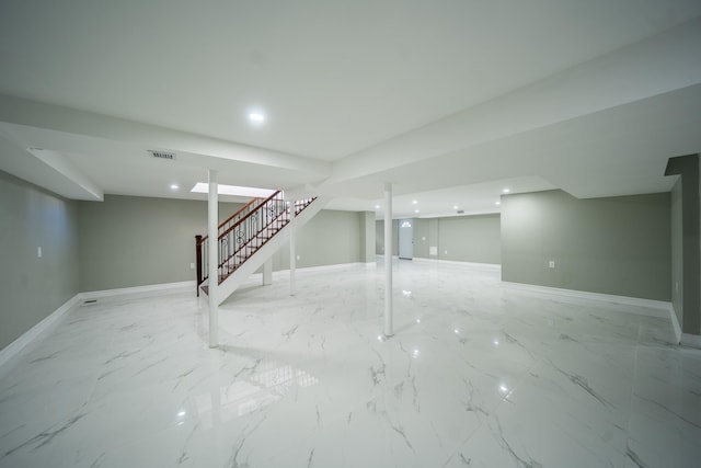 finished below grade area with visible vents, marble finish floor, recessed lighting, stairway, and baseboards