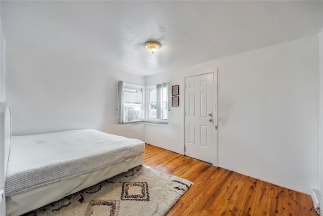 bedroom with wood finished floors