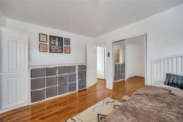 bedroom with wood finished floors