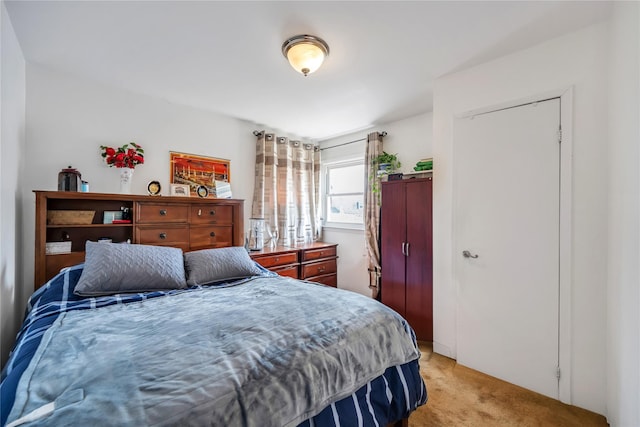 bedroom with light colored carpet