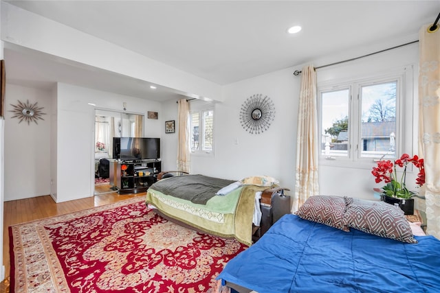 bedroom featuring recessed lighting and wood finished floors