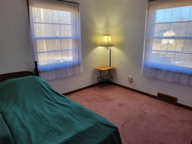 unfurnished bedroom with visible vents, baseboards, and carpet floors