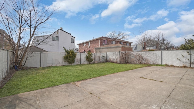 view of yard with a patio and a fenced backyard