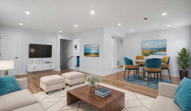 living room with visible vents, recessed lighting, baseboards, and wood finished floors