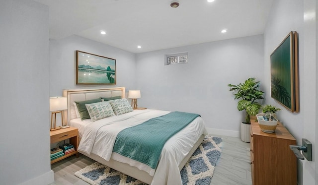 bedroom with recessed lighting and baseboards