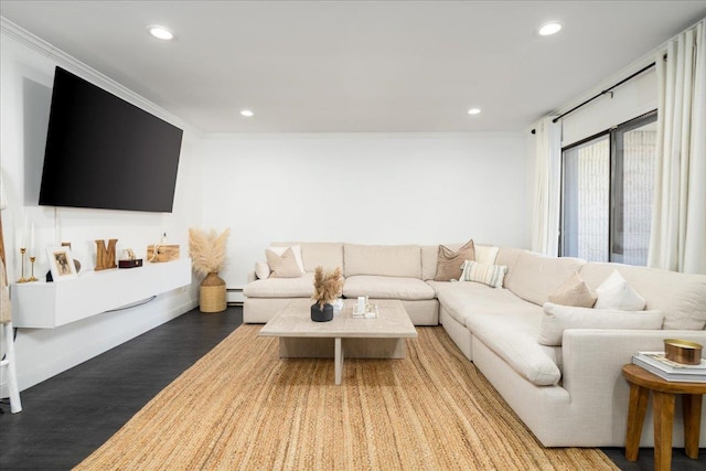 living room featuring recessed lighting, a baseboard heating unit, crown molding, and wood finished floors