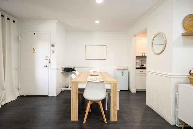 dining space with dark wood-style floors, recessed lighting, wainscoting, and ornamental molding