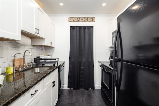 kitchen with white cabinets, black appliances, and ornamental molding