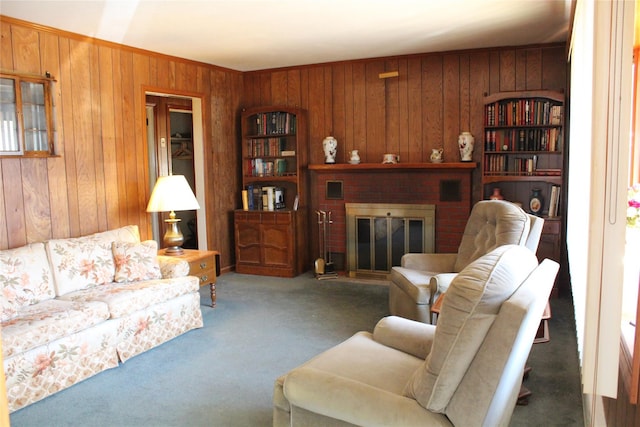 carpeted living area featuring wood walls and a brick fireplace