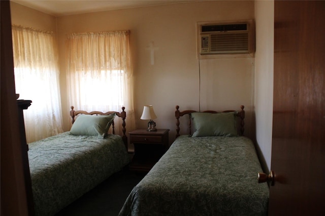 bedroom with a wall mounted air conditioner