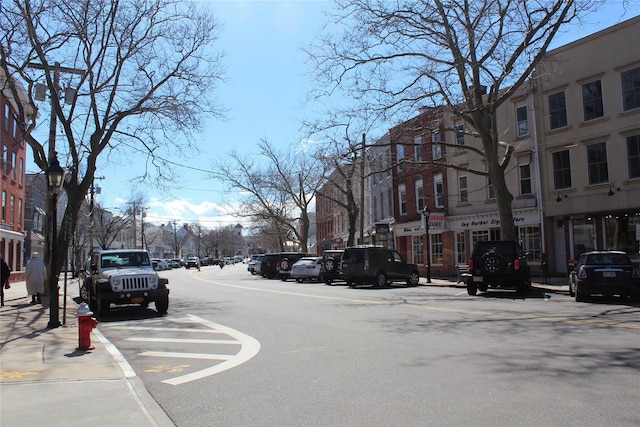 view of street featuring curbs and sidewalks