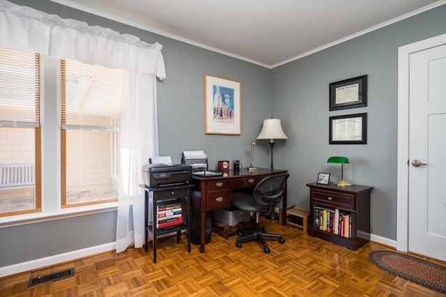 home office with visible vents, baseboards, and crown molding