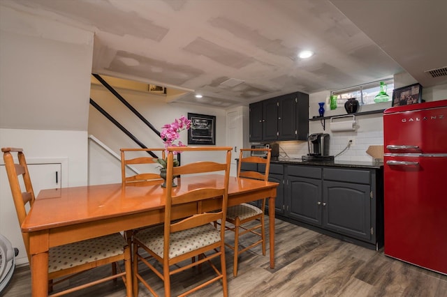 dining space with recessed lighting, visible vents, and dark wood-type flooring