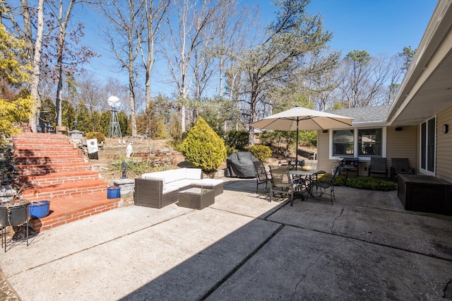 view of patio / terrace featuring outdoor dining space, an outdoor living space, and area for grilling