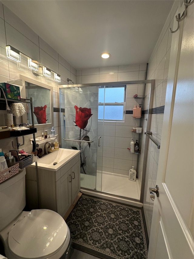 bathroom featuring a stall shower, toilet, and vanity