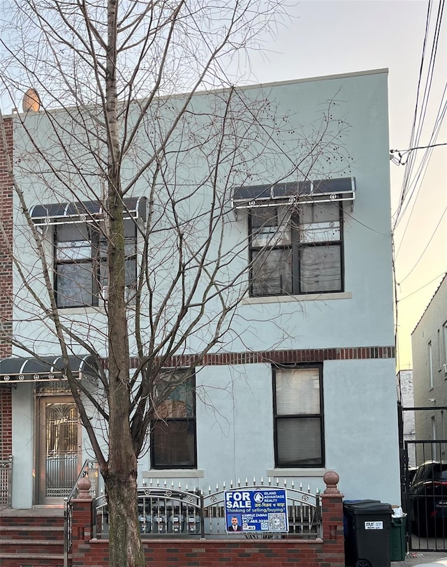 view of front of house featuring stucco siding