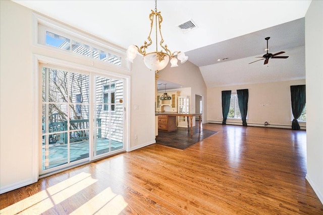 69 Leber Rd, Blauvelt, NY 10913 - unfurnished living room featuring baseboards, ceiling fan with notable chandelier, wood finished floors, and visible vents