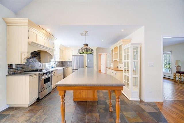 69 Leber Rd, Blauvelt, NY 10913 - kitchen with backsplash, stainless steel appliances, baseboards, and pendant lighting