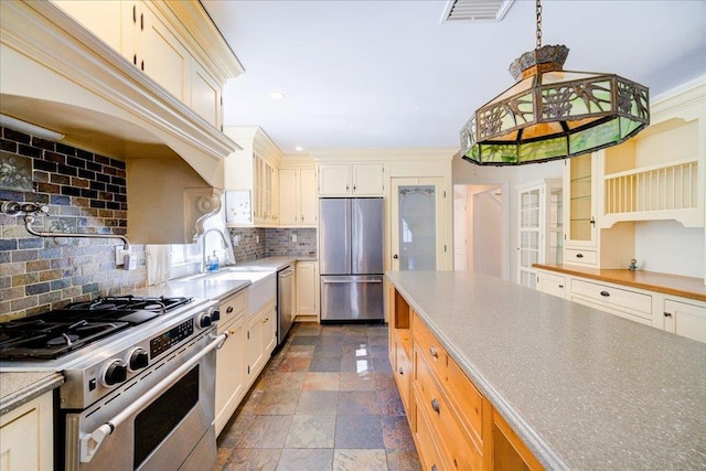 69 Leber Rd, Blauvelt, NY 10913 - kitchen featuring visible vents, decorative backsplash, stone finish floor, a sink, and stainless steel appliances