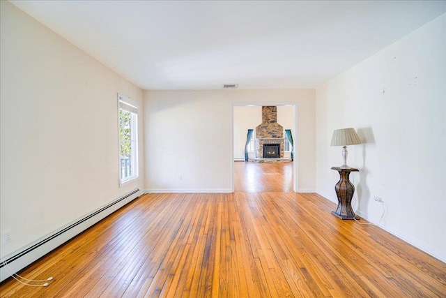 69 Leber Rd, Blauvelt, NY 10913 - empty room with baseboards, a baseboard radiator, hardwood / wood-style floors, and visible vents
