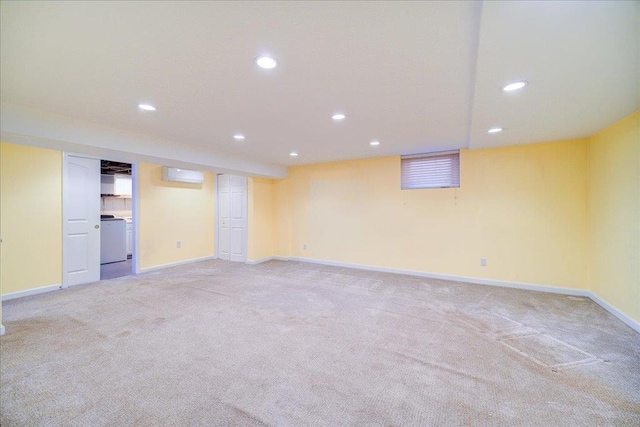 69 Leber Rd, Blauvelt, NY 10913 - finished basement with baseboards, a wall mounted AC, recessed lighting, and light colored carpet