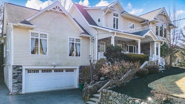 69 Leber Rd, Blauvelt, NY 10913 - view of front of home featuring driveway, stone siding, and a garage