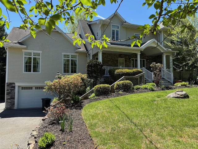 69 Leber Rd, Blauvelt, NY 10913 - view of front of property with a garage, aphalt driveway, a front lawn, and stone siding
