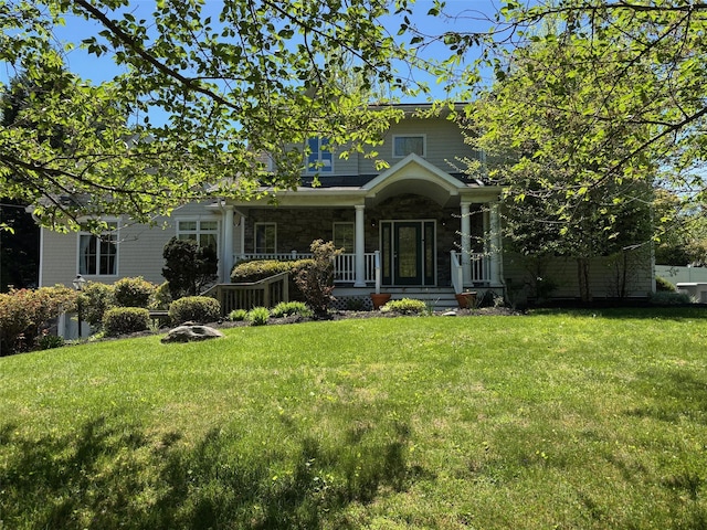 69 Leber Rd, Blauvelt, NY 10913 - view of front of house featuring covered porch, stone siding, and a front lawn