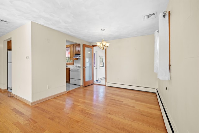 unfurnished dining area featuring visible vents, baseboard heating, light wood-type flooring, and a baseboard radiator