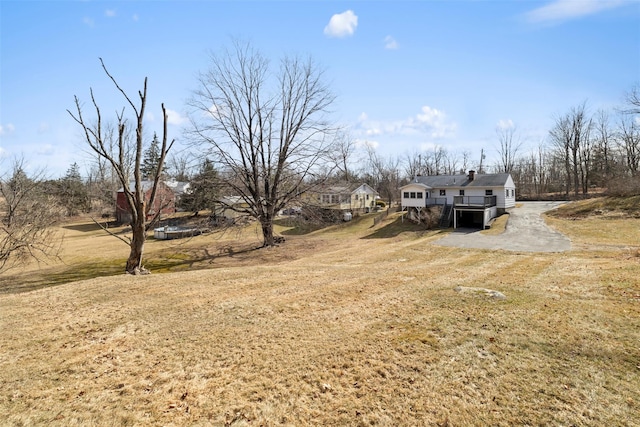 view of yard featuring a wooden deck